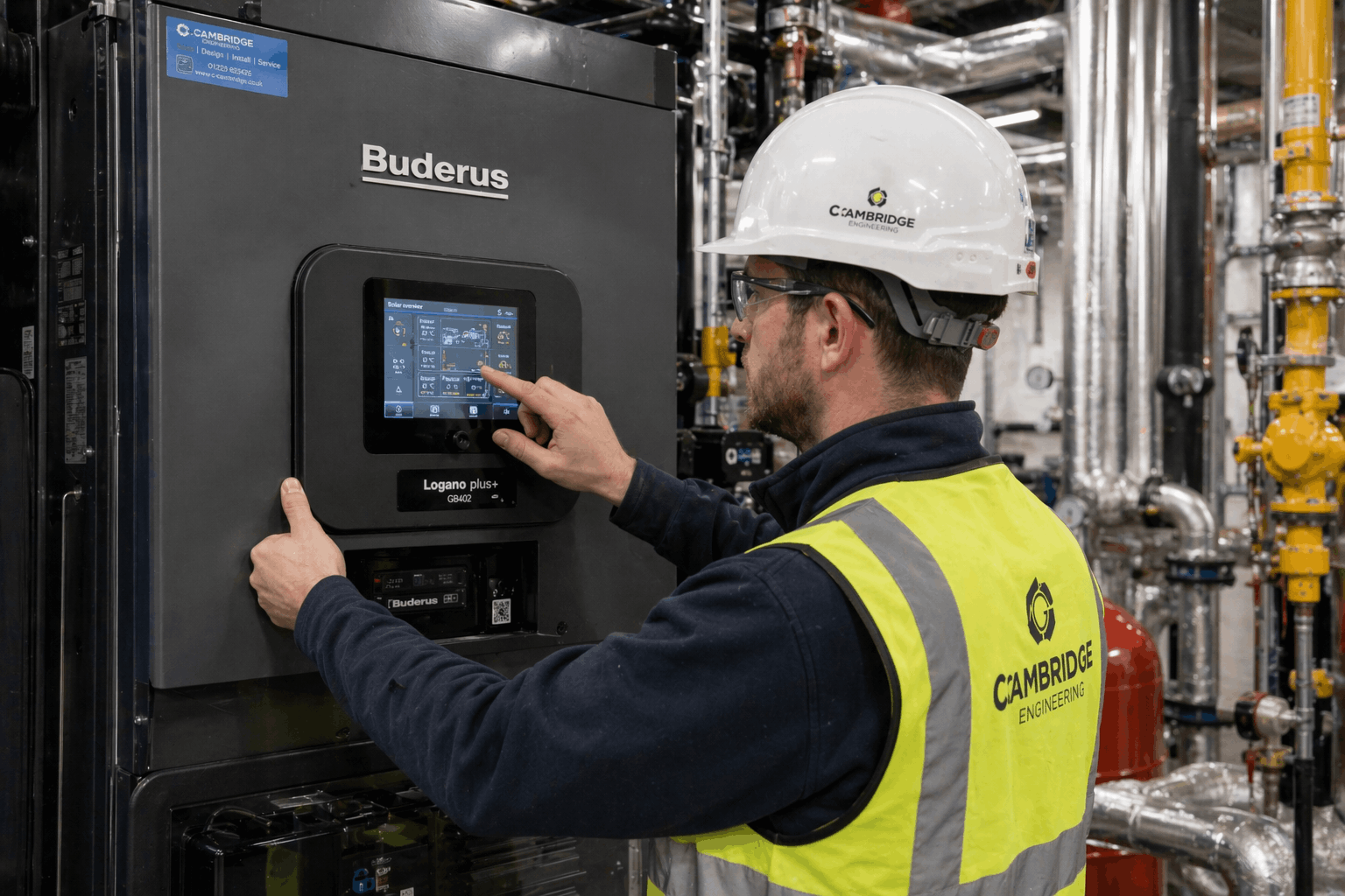 Advanced heating control panel being configured during commercial boiler installation Cambridge by certified NAPIT engineer