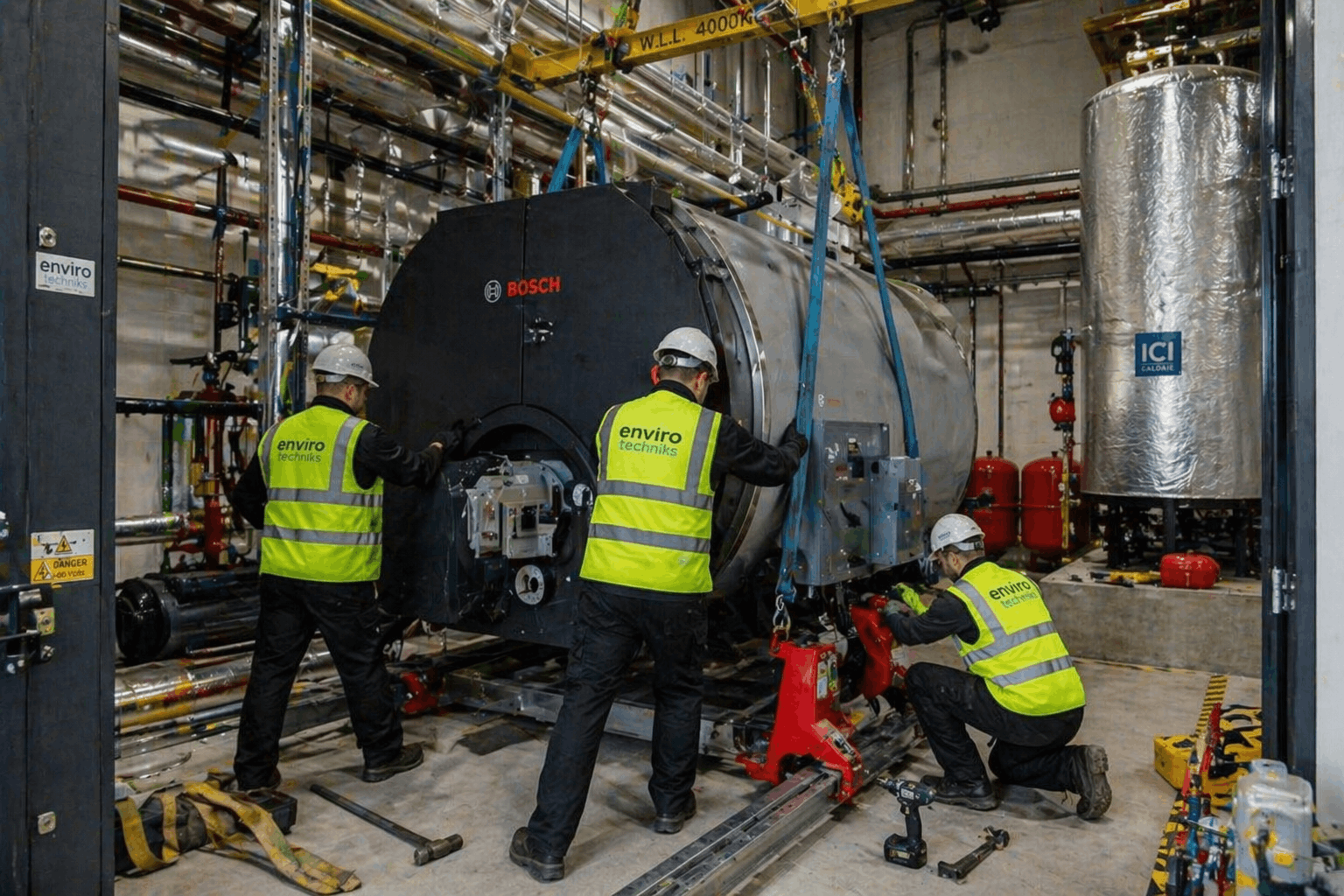 Commercial boiler unit being positioned and installed in plant room of Sudbury business facility