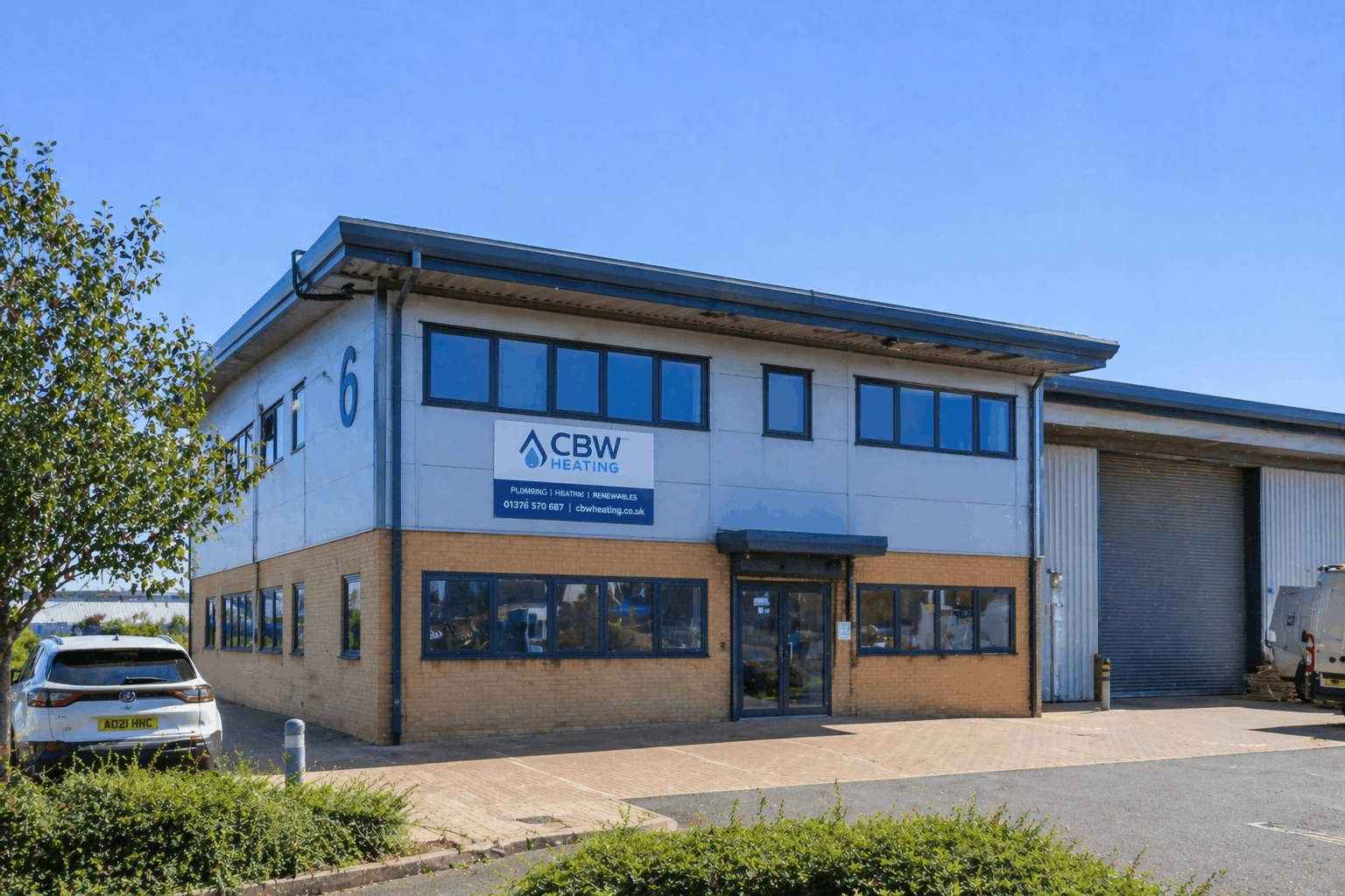 Modern commercial business building exterior in Braintree requiring professional hot water systems installation