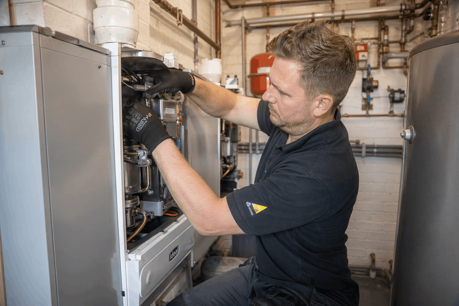 Commercial boiler replacement in progress at Colchester business showing new high-efficiency heating system installation