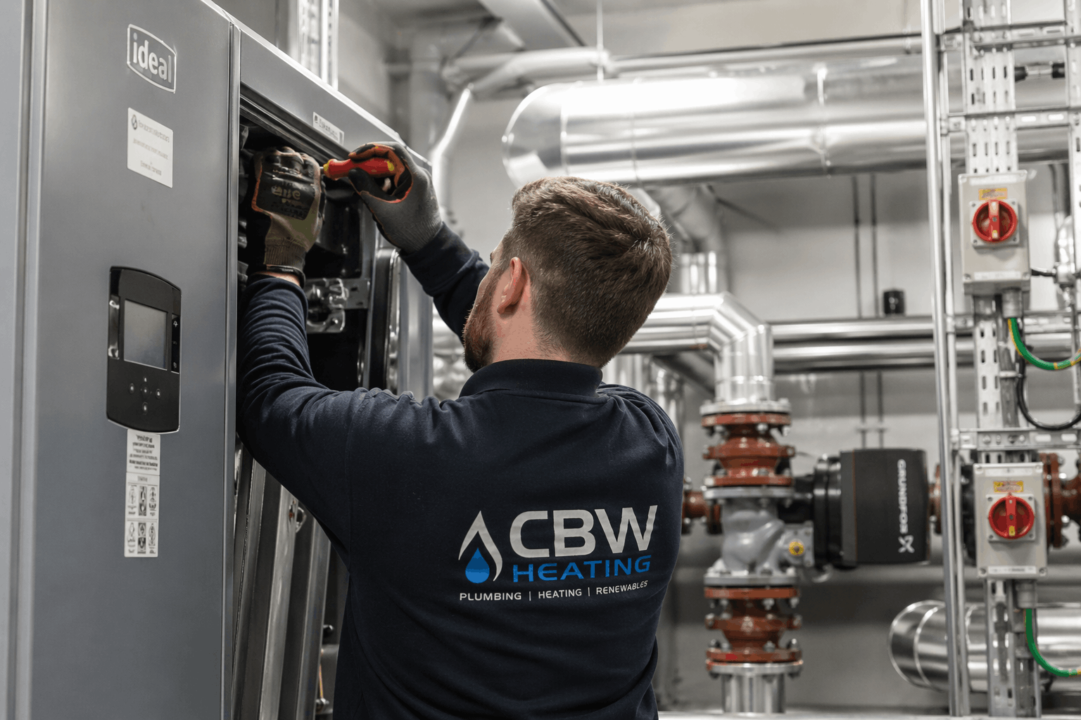 Commercial hot water system installation in Colchester business premises showing professional pipework