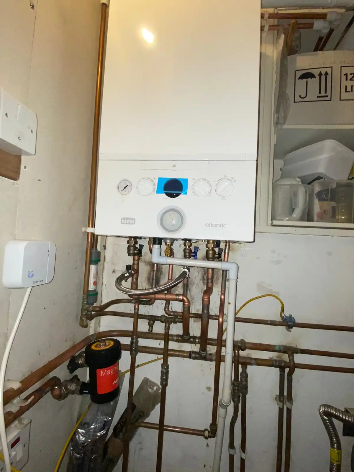 Wall-mounted gas boiler with copper heating pipework and magnetic system filter