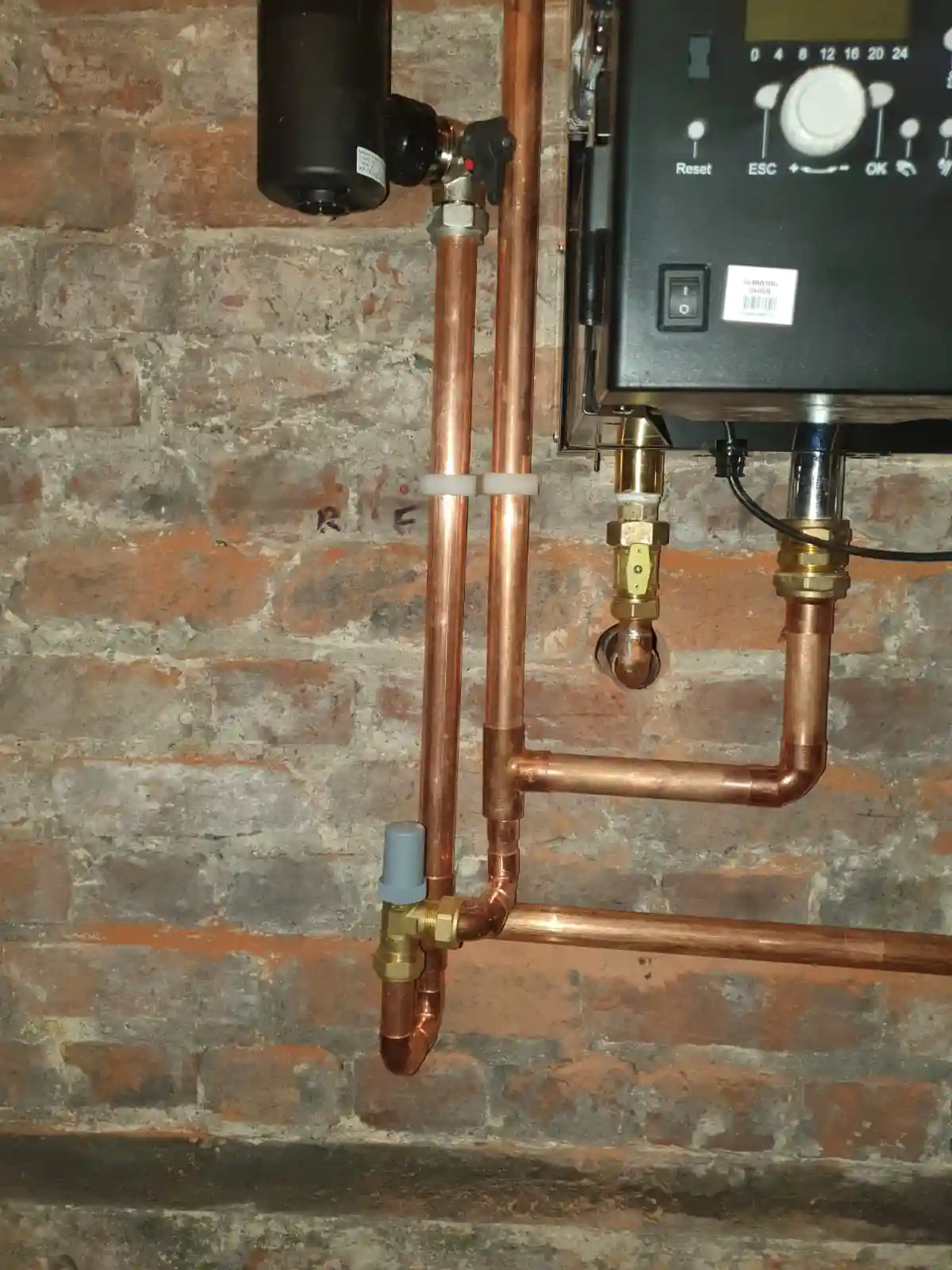 Copper boiler and central heating pipework with valves and system controls