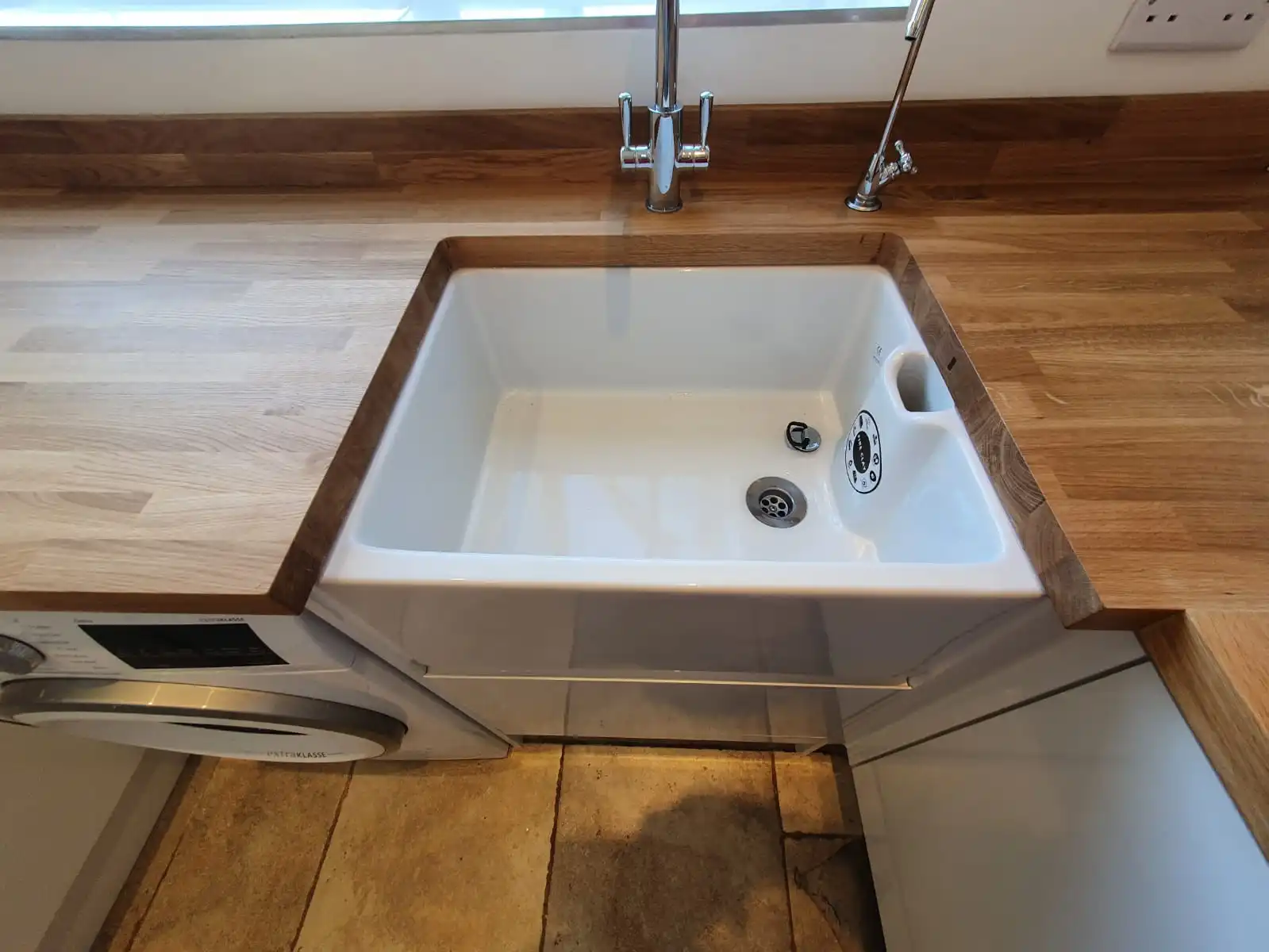 Kitchen sink installation with mixer tap and drinking water tap